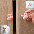 Bunny ear cabinet knob installed on a wooden cabinet, ideal for kids' rooms.