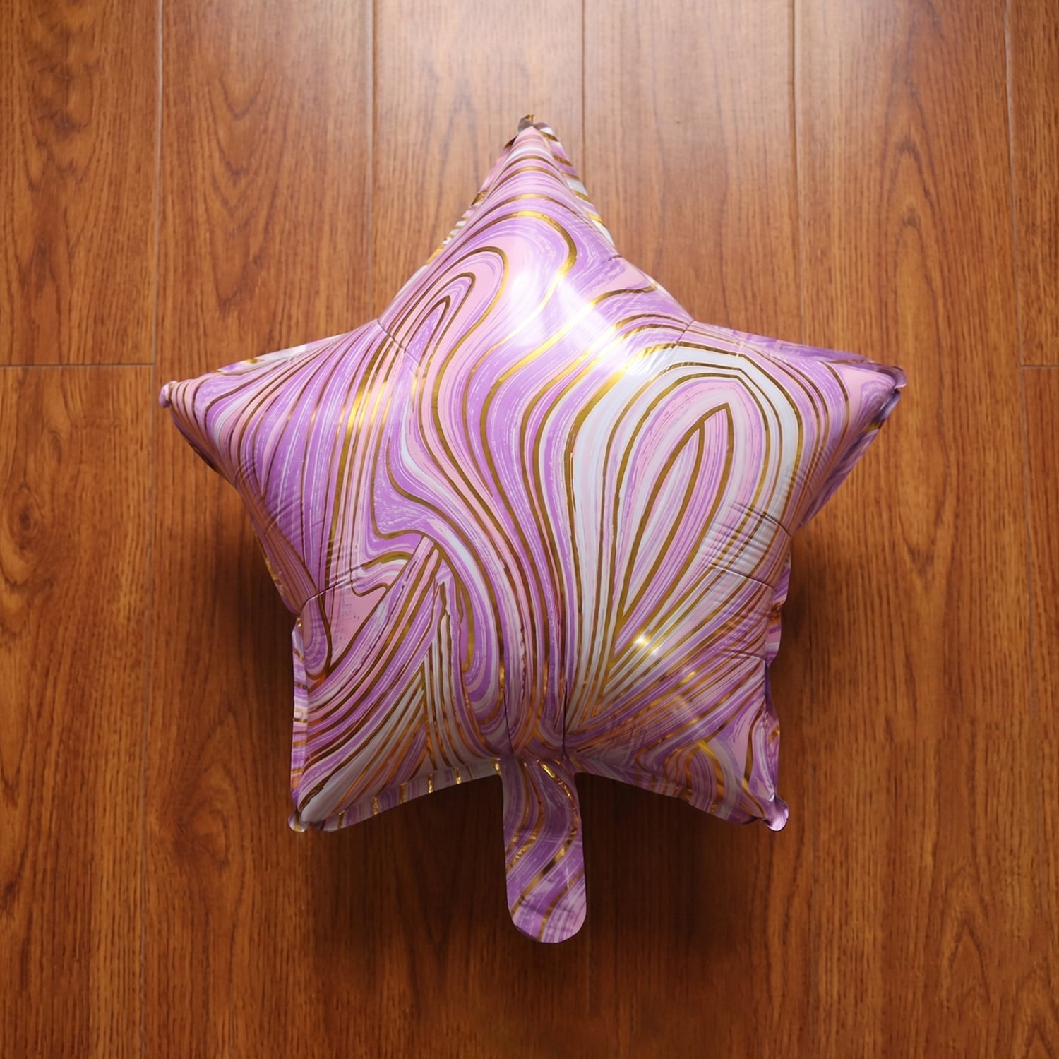 Front view of star marble foil balloon