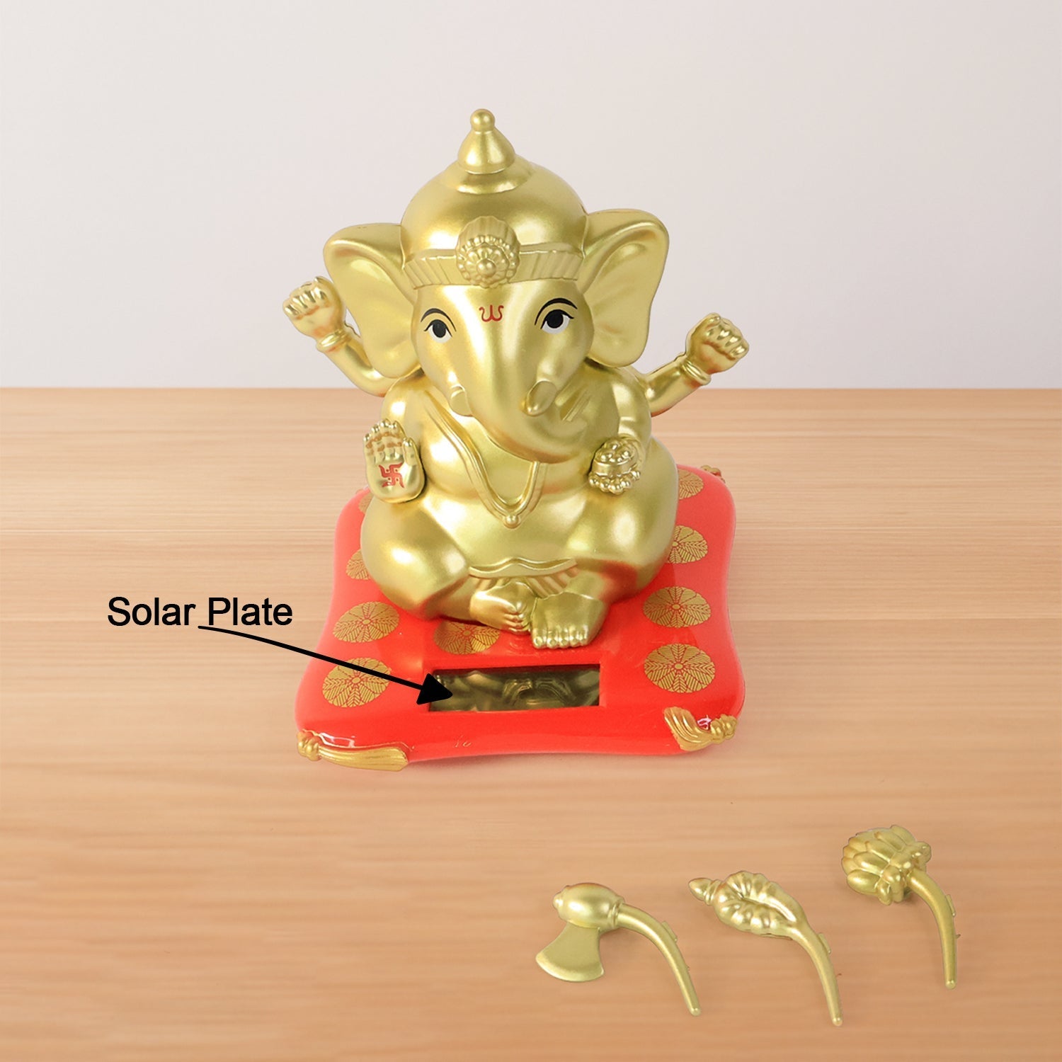Decorative religious idol of Lord Ganesha with vibrant red base