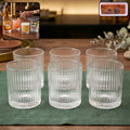 Set of six ribbed crystal glass tumblers for elegant serving