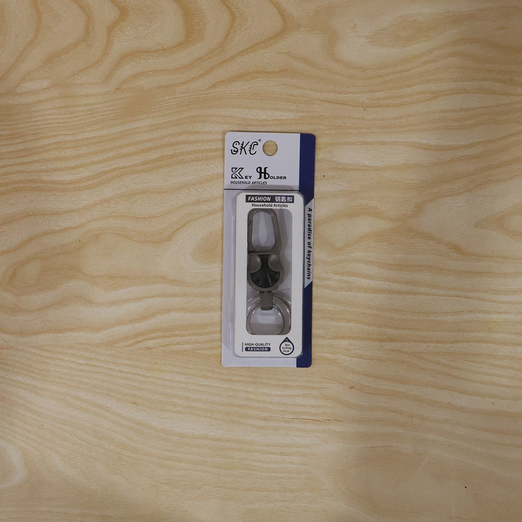 Close-up of stylish metal key holder with lock clip