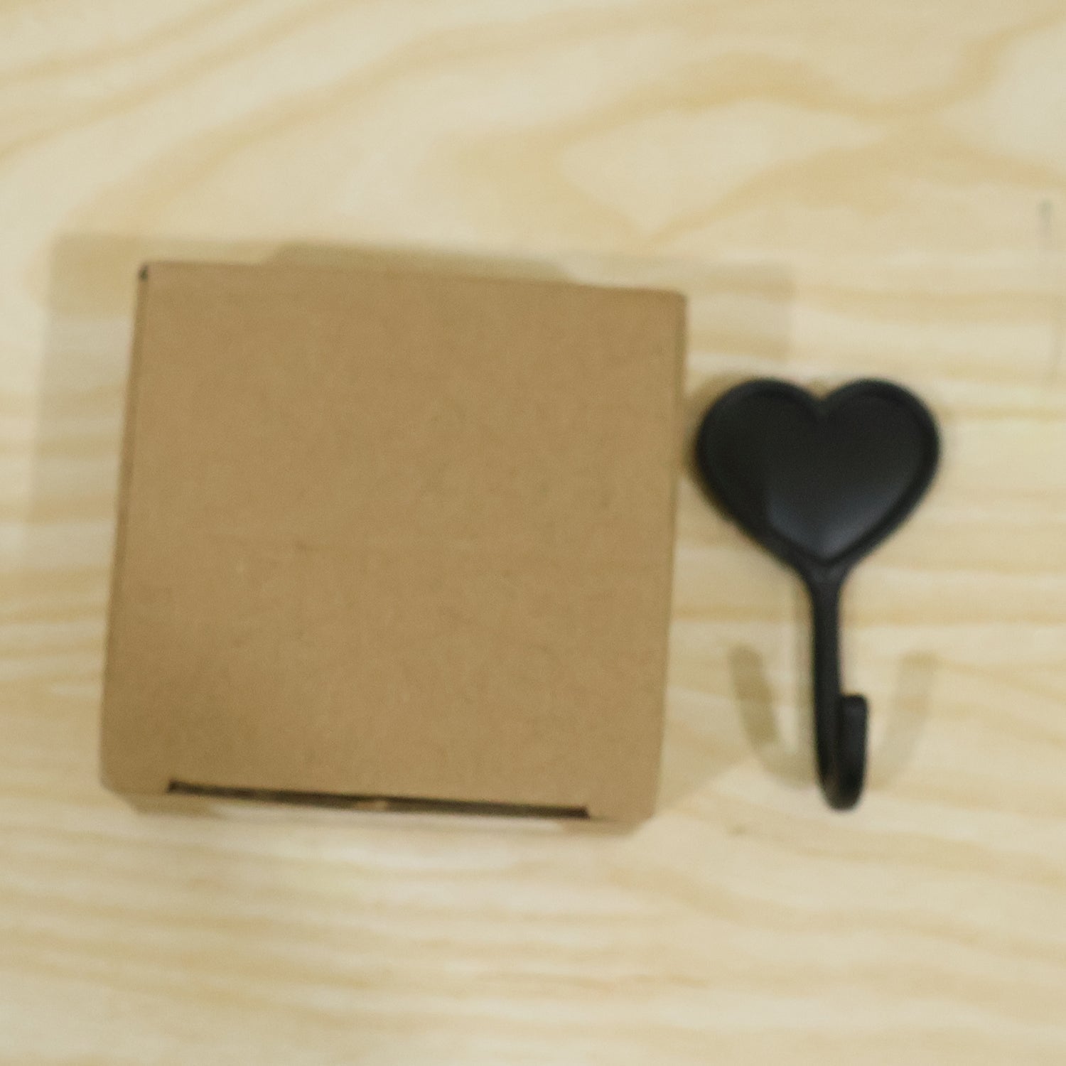 Space saving stick on hook for keys and small items