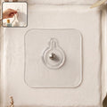 Self-adhesive transparent wall hook with metal stud design