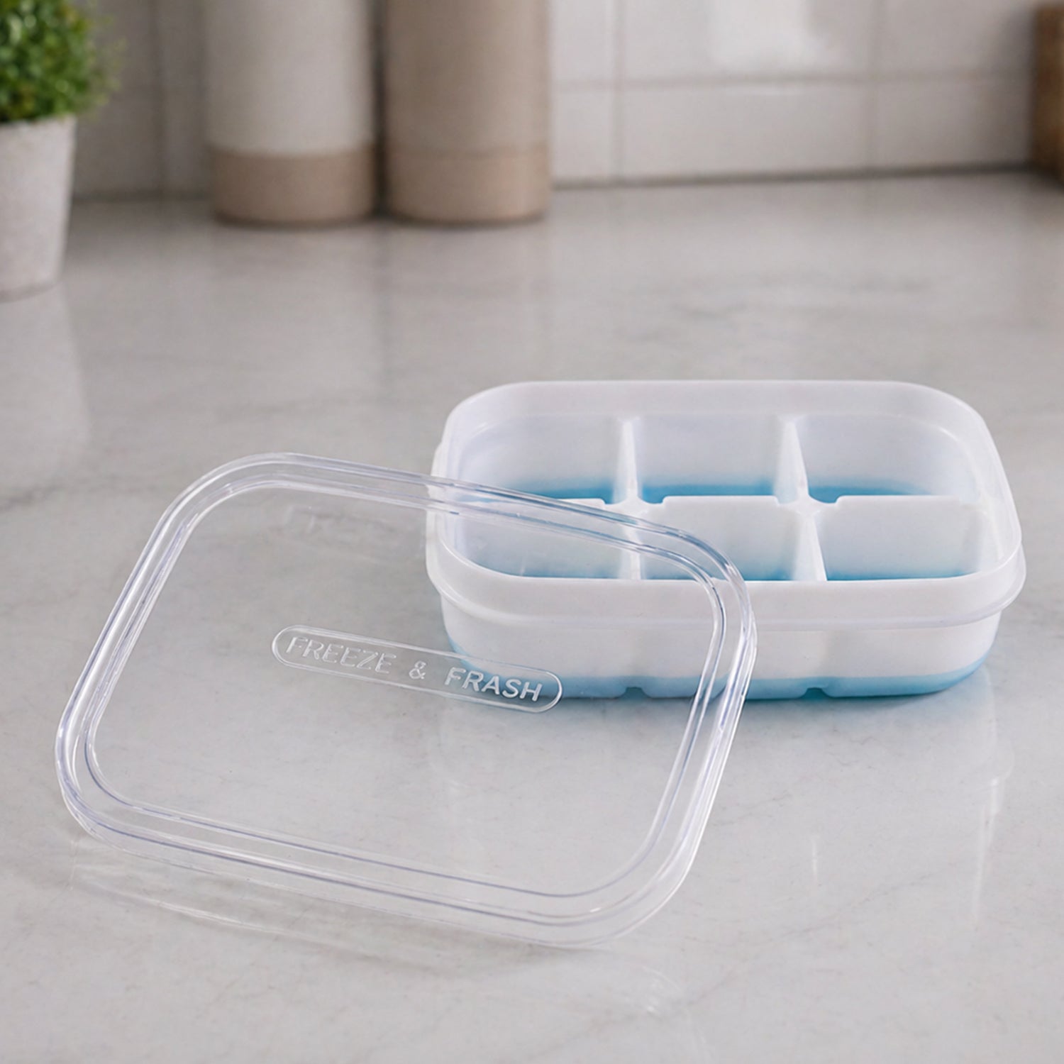 Side view of the mini plastic ice tray highlighting its space saving design.