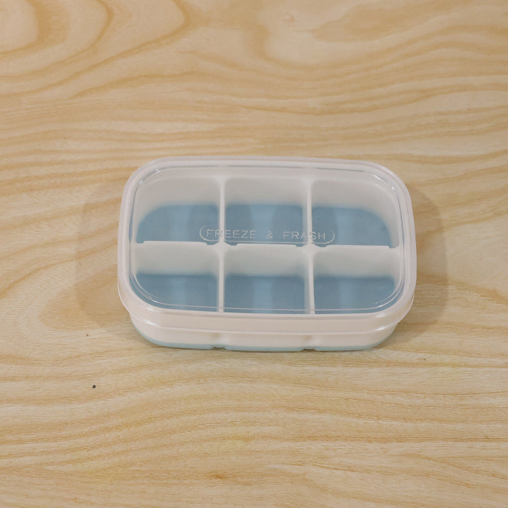 Compact home ice tray in use, perfect for small freezers and daily needs.