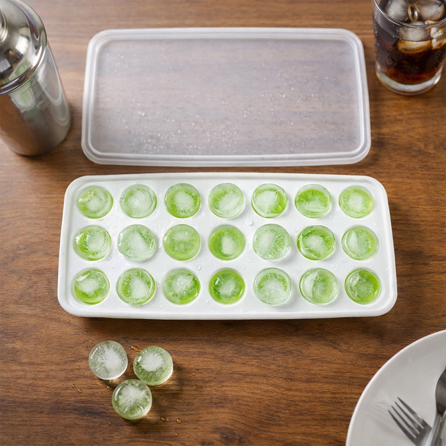 Secure lid on a plastic ice cube tray preventing spills and keeping ice fresh in the freezer.
