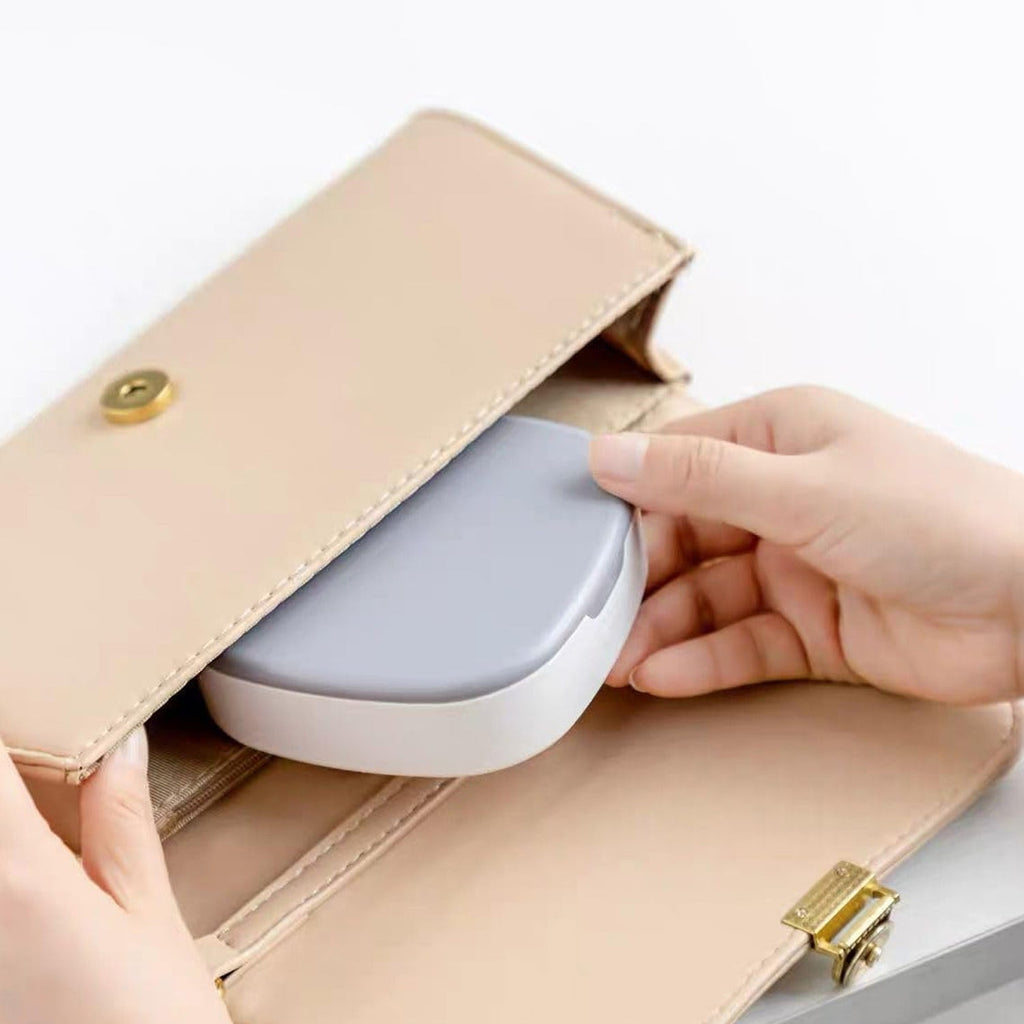 Open view showing compartments of plastic jewelry box