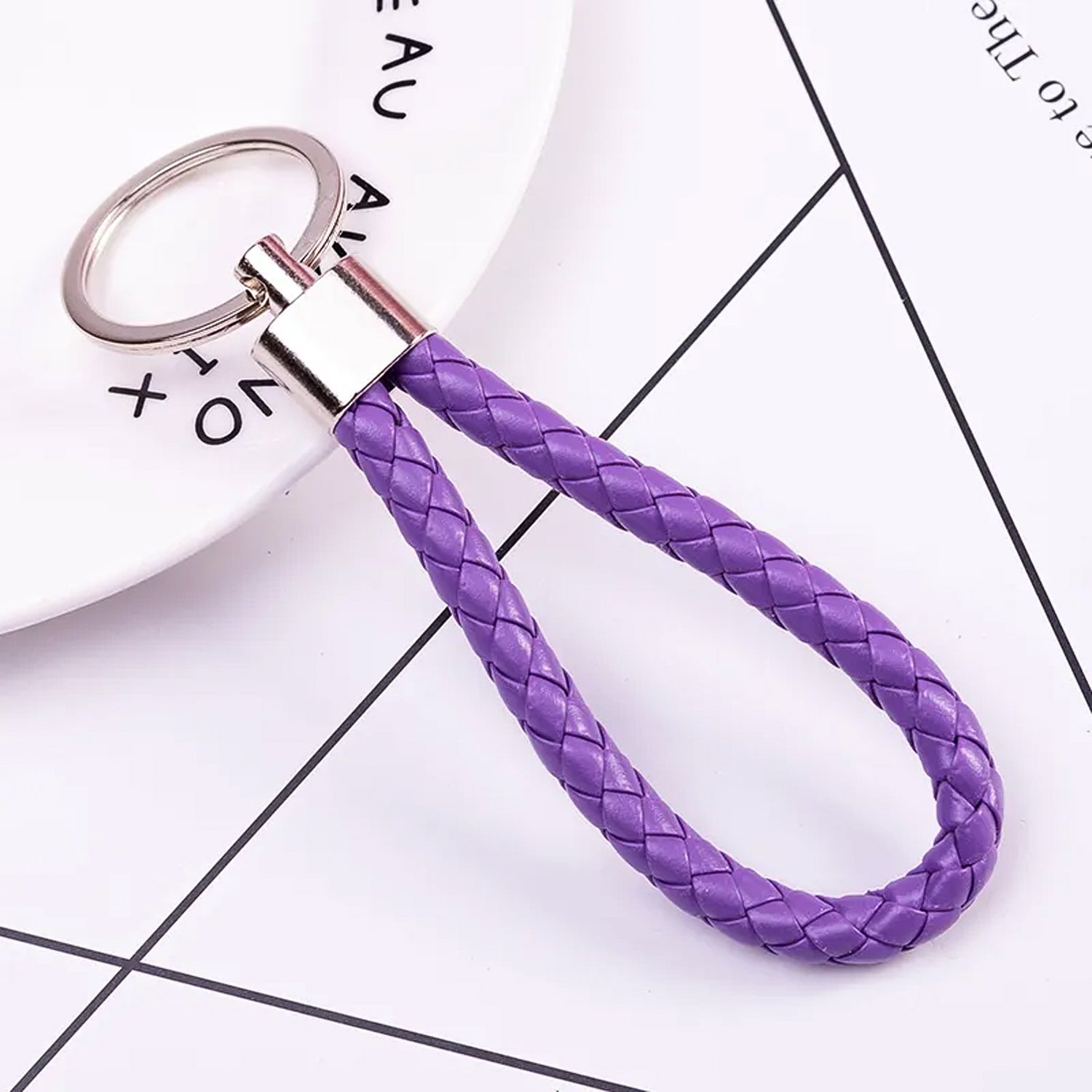 Close-up view of the braided texture and metal ring of the keychain