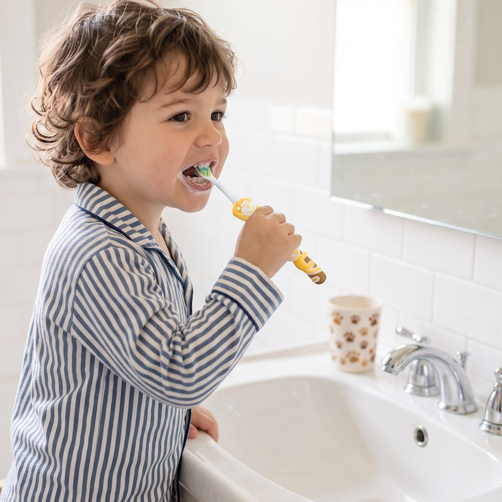 Colourful kids toothbrush with soft bristles and toy figure
