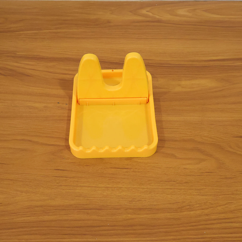 Kitchen lid and spoon holder stand in use with utensils and lids