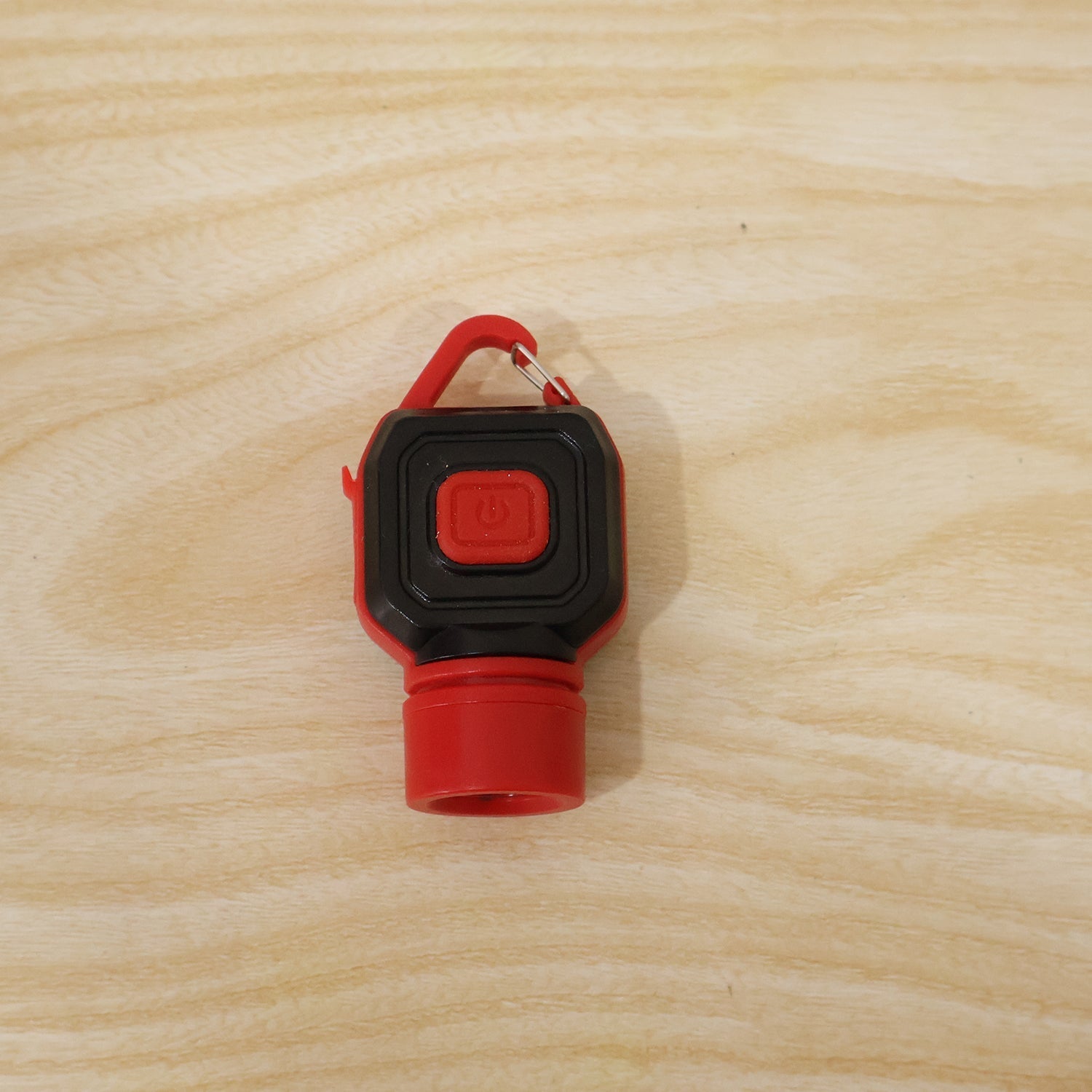 Travel LED flashlight keychain in use on the go