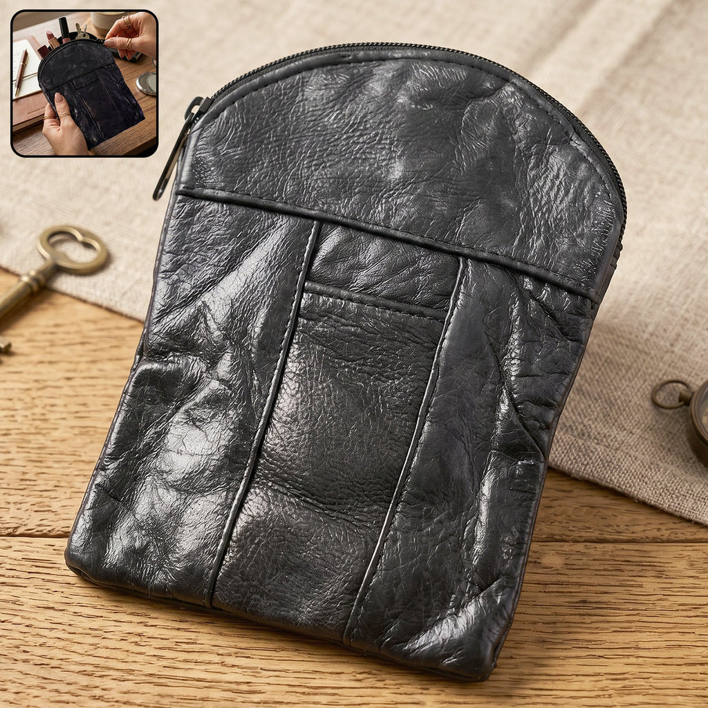 Complete view of the petite black leather coin and card holder.