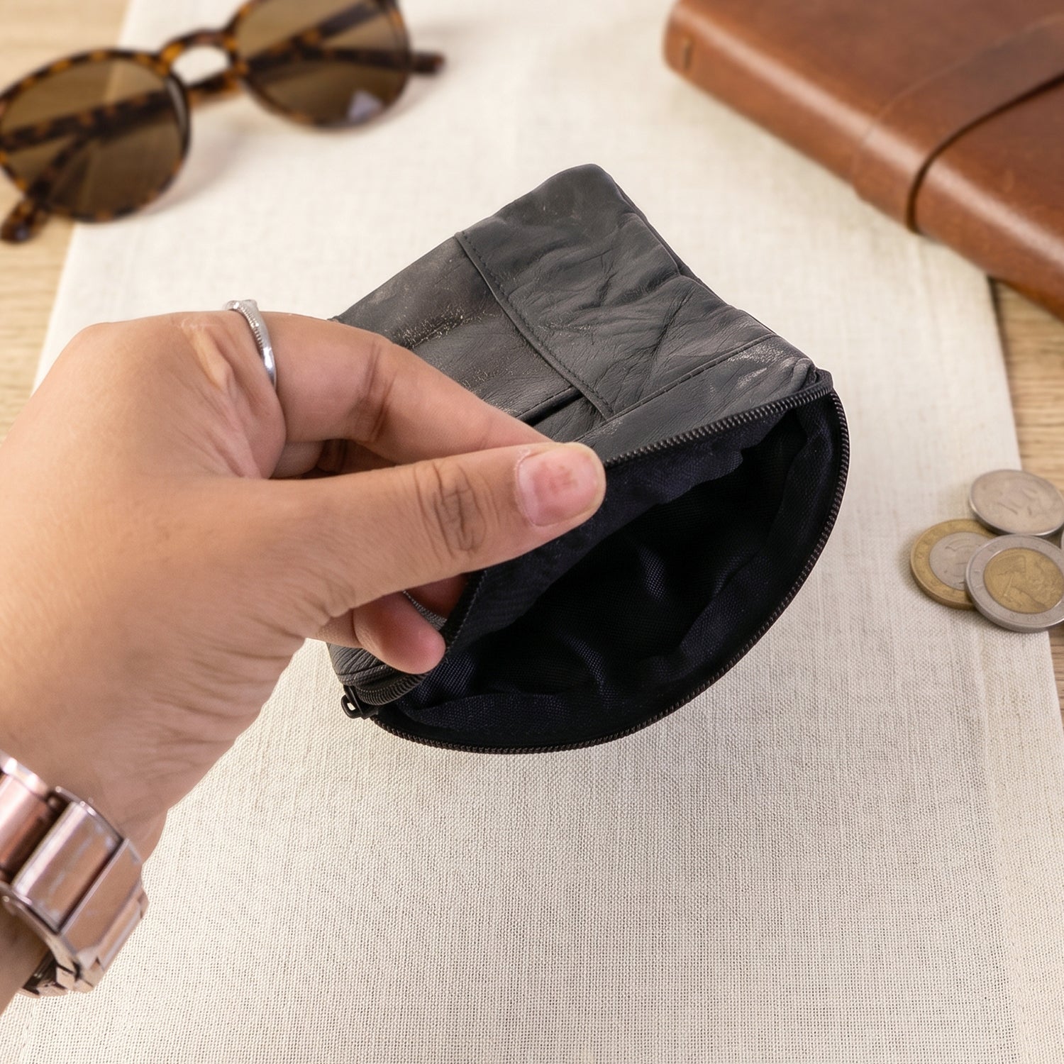 Interior view of the compact leather coin and card pouch.