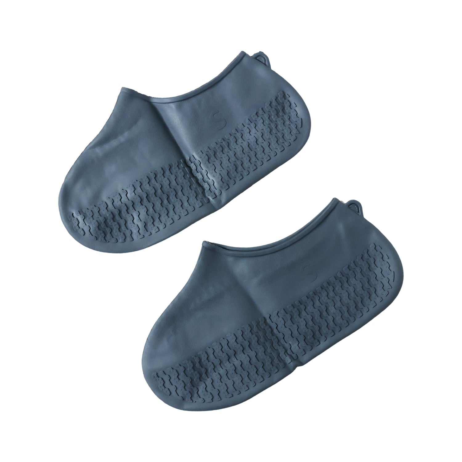 A pair of dark gray silicone shoe covers with textured soles is displayed against a plain white background.