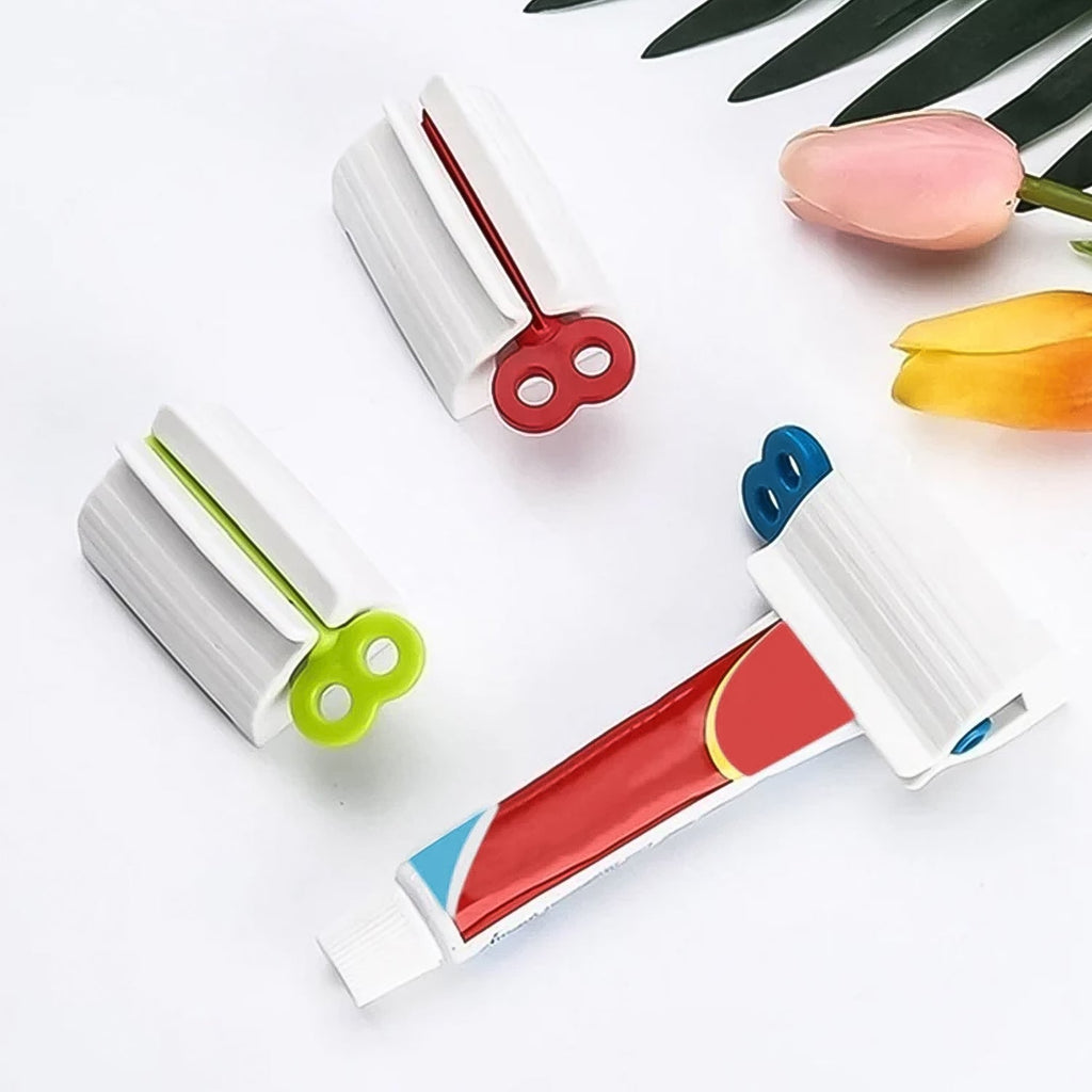 Close-up of ergonomic tube squeezer dispensing toothpaste evenly
