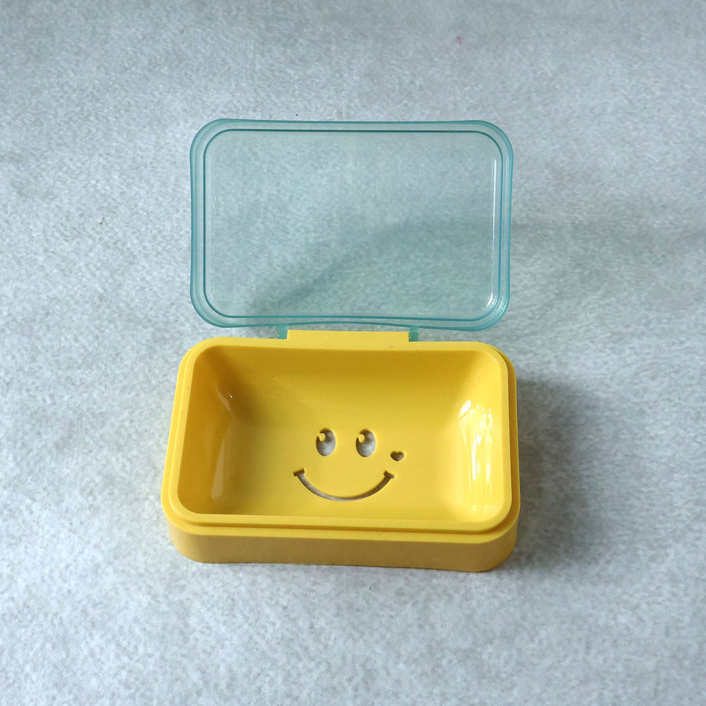 Lightweight plastic soap dish with smiley design