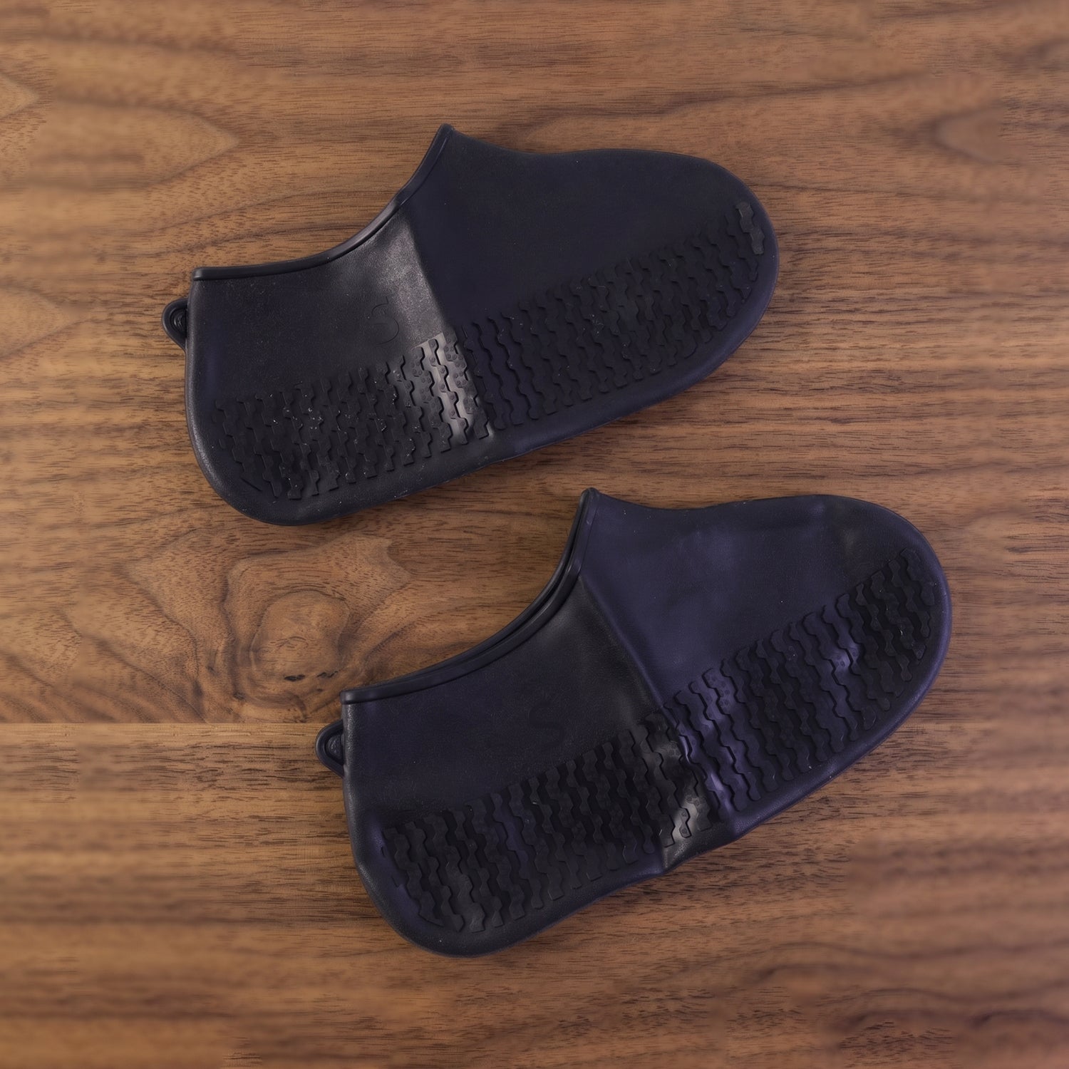 Black waterproof shoe cover displayed on white background shoe covers