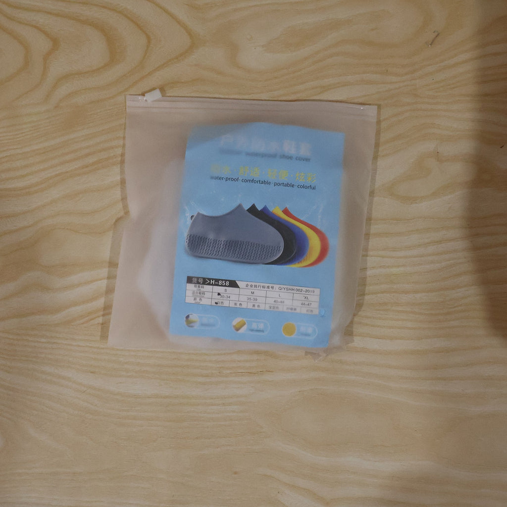 Small white waterproof silicone rain shoe cover in a daily use scenario.