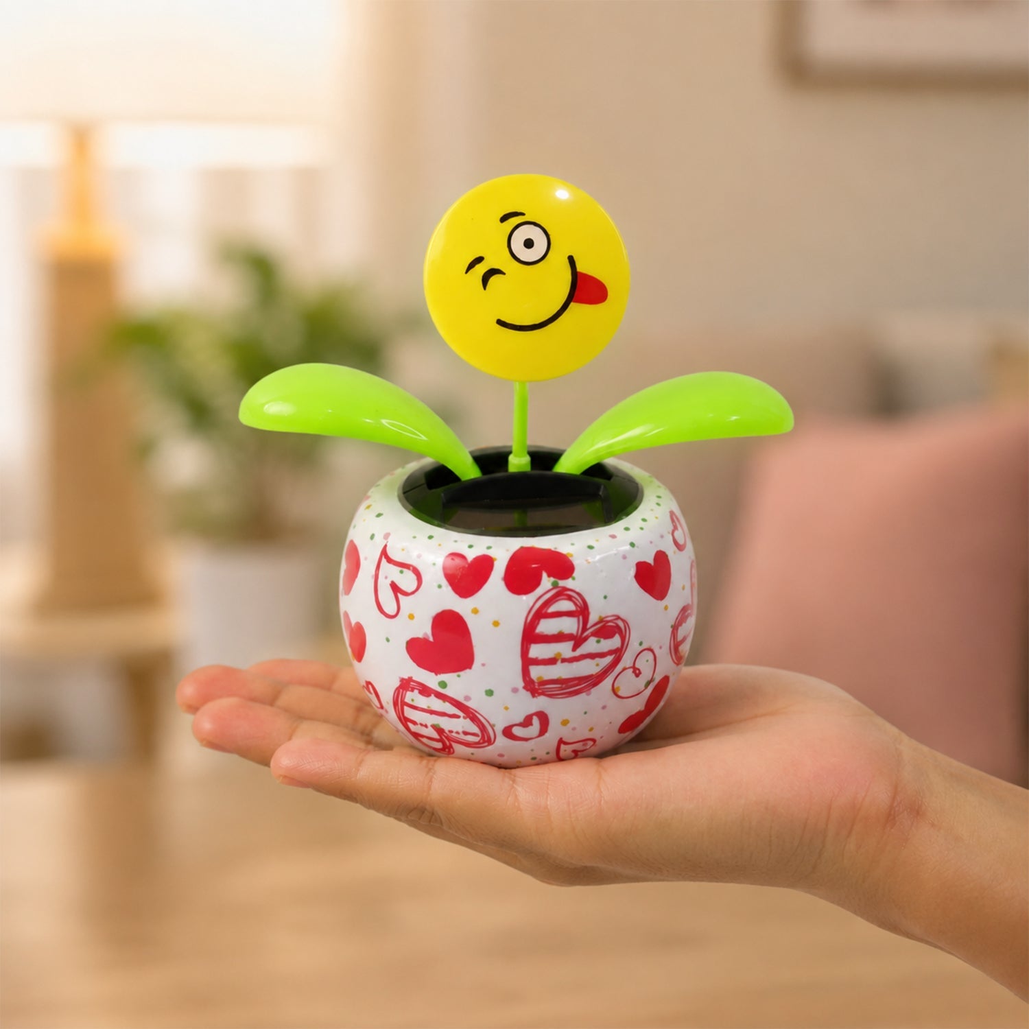 Solar activated bobbing flower toy for dashboard and shelves