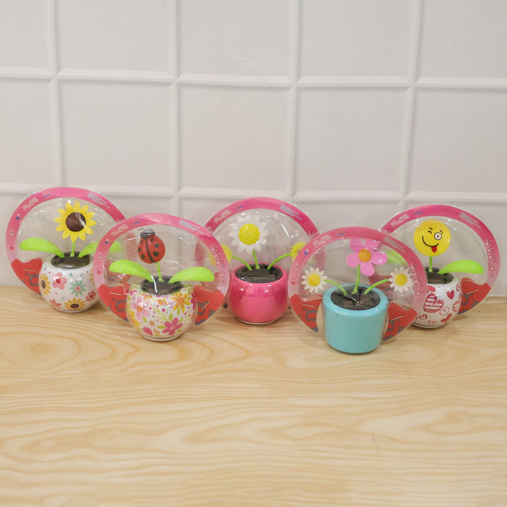Fun solar powered flower pot toy that dances with light