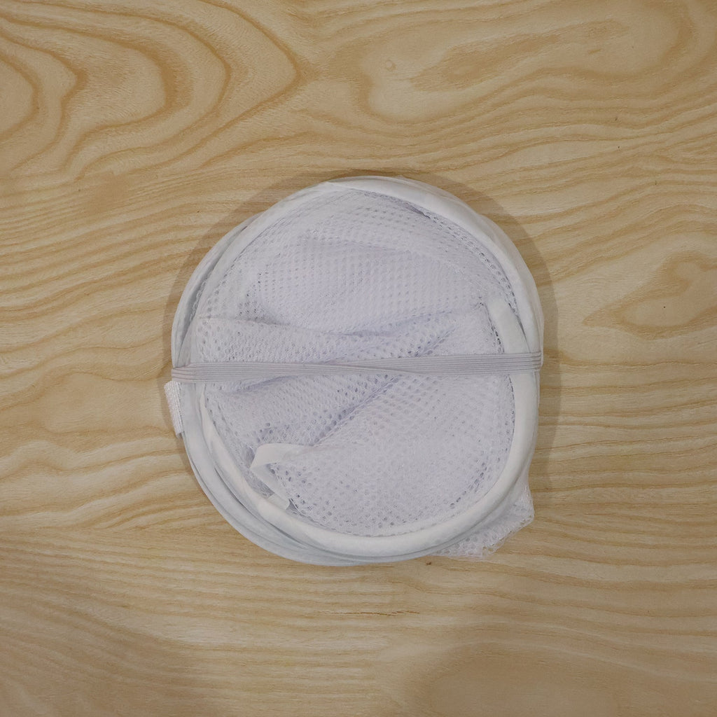 Foldable clothes hamper with handles for easy transport
