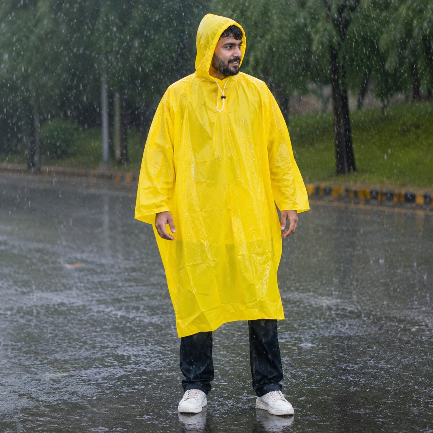 Full length view of the reusable yellow raincoat, ideal for the rainy season.