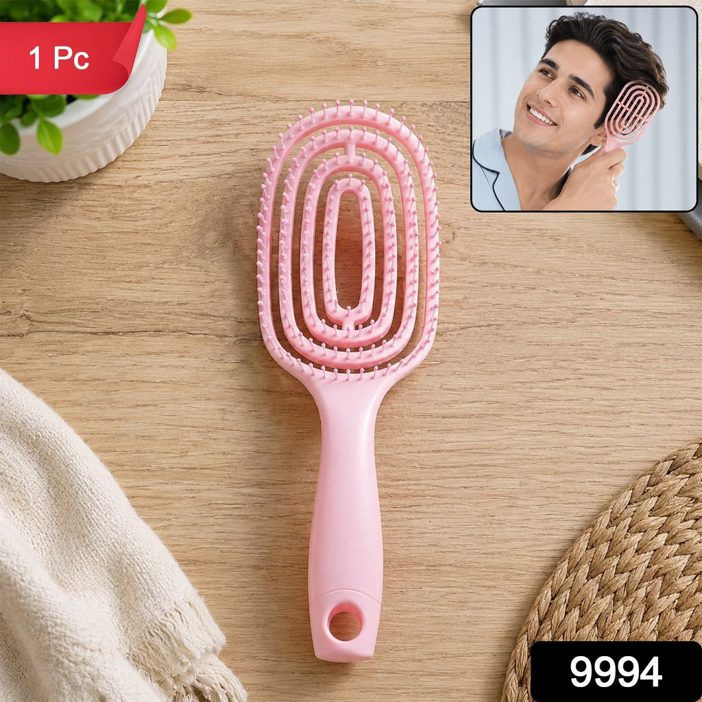 Back view of the men's curved hair brush highlighting its ergonomic design.