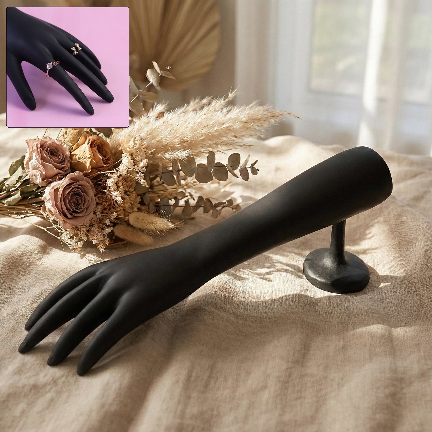 Black hand jewelry display stand with matte finish showing front view