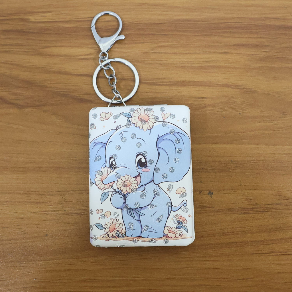 Foldable compact mirror keychain closed with elephant design visible