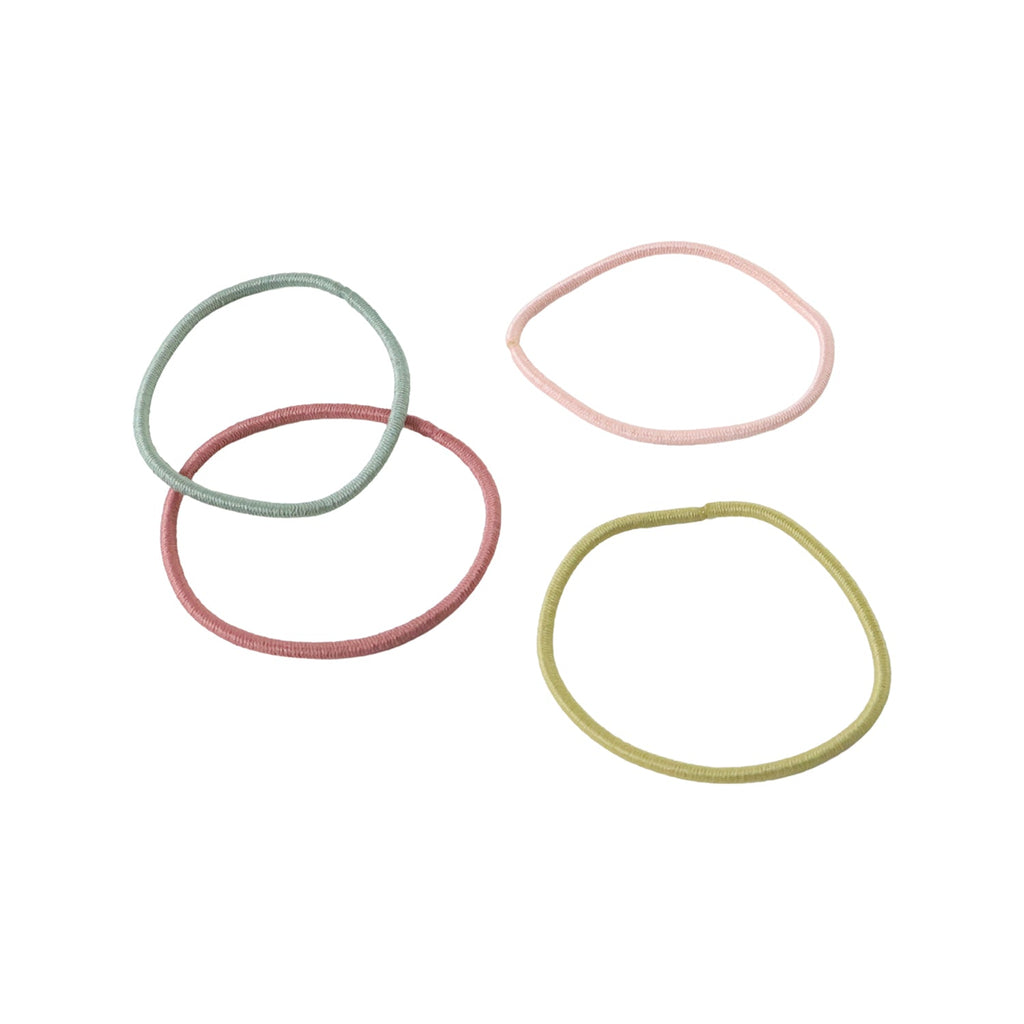 Elastic hair ties in neutral colours, gentle and secure for all hair lengths and types.