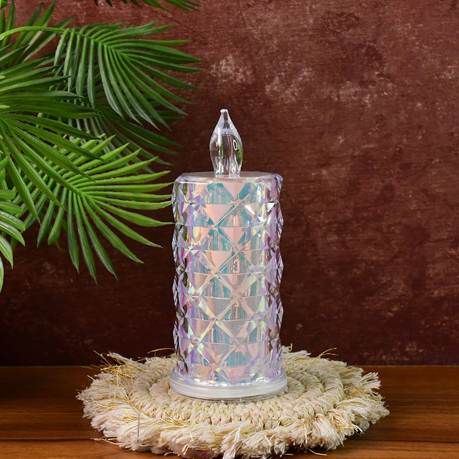 Decorative LED candles with holographic surface placed on decorative tray