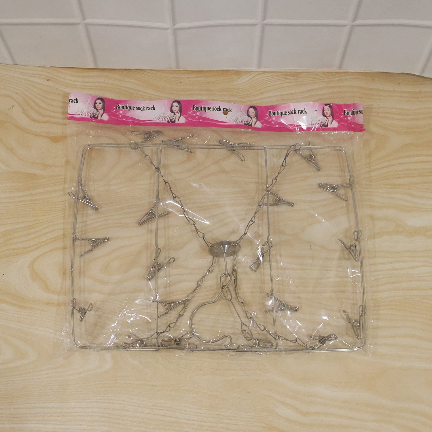 Foldable multi clip hanger for socks, bibs and handkerchiefs