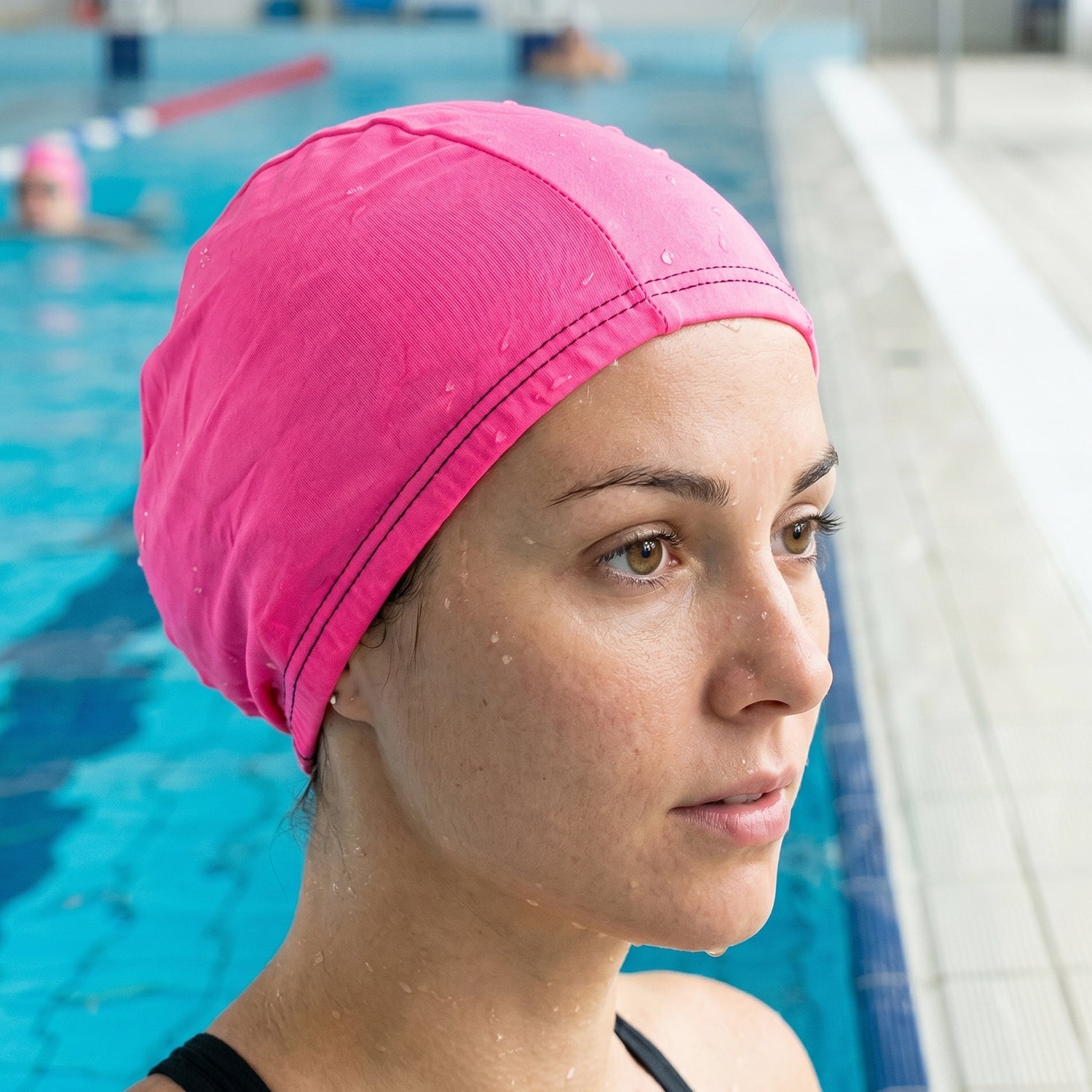 Flexible pink swimming cap made from durable materials